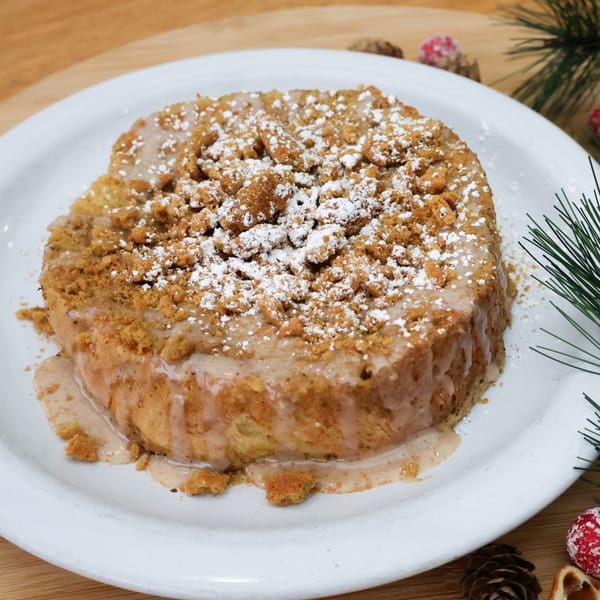 Sassy Onion's French toast, topped with streusel, powdered sugar, and a creamy glaze.